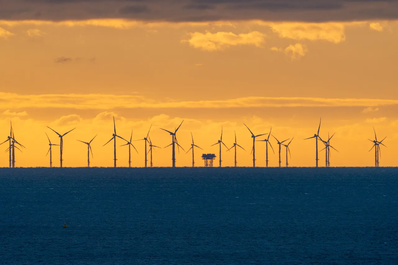 Shot of the Rampion Wind Farm and Substation at sunset