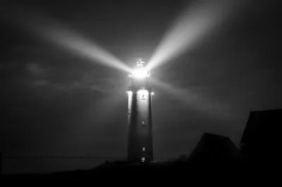 lighthouse-night-sea-coast.jpeg