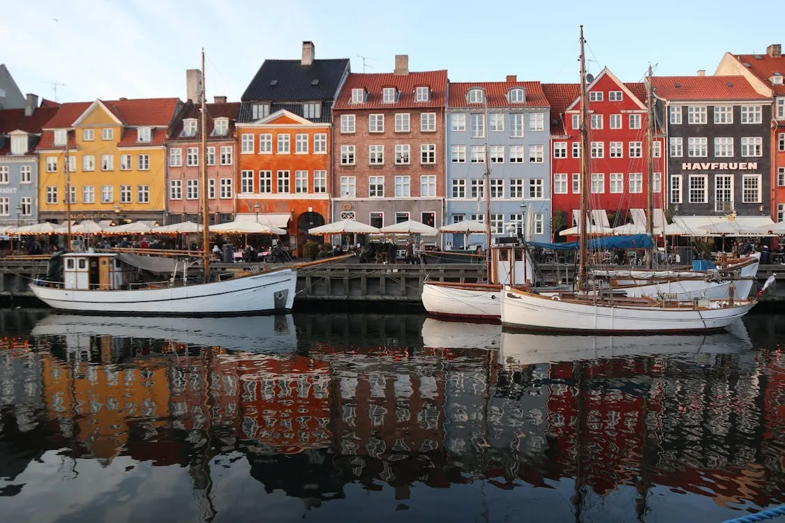 Free A row of colorful buildings next to a body of water Stock Photo