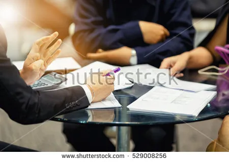 stock-photo-sales-manager-giving-advice-to-his-couple-clients-529008256.jpg