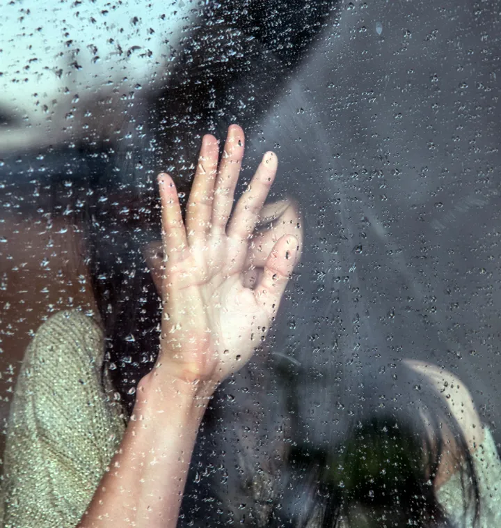 Female hand on glass_720.jpg