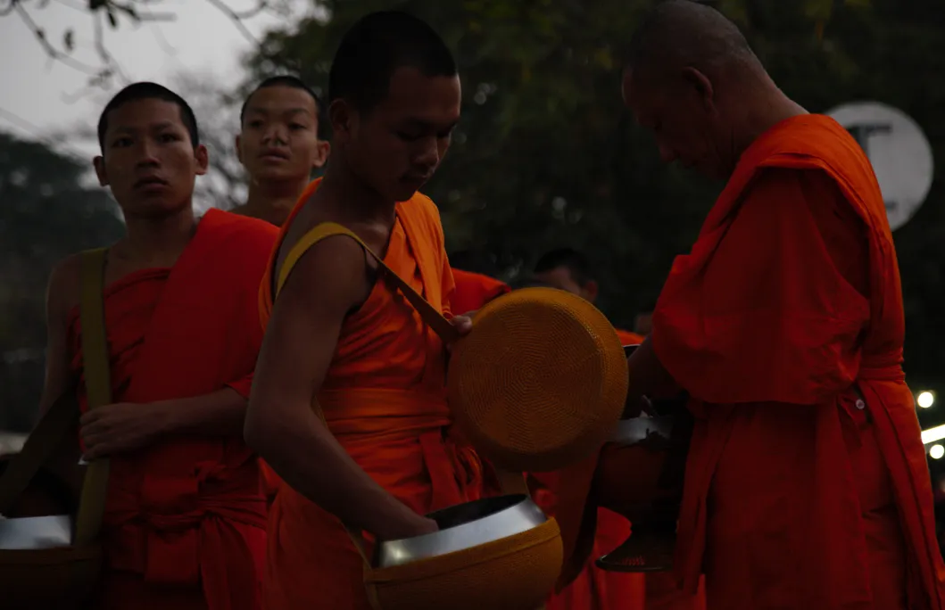 Giving the important gift to the head monk