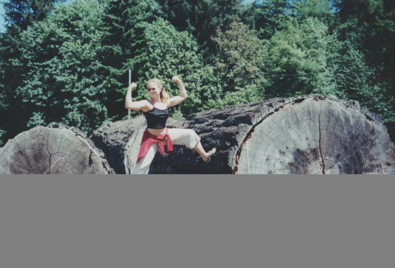 2000's - Katie Strong on Logs maybe beach and log cabin place.jpg