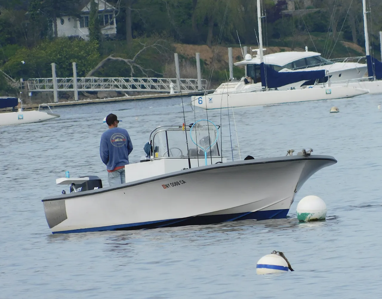 man fishing on a boat amazing nature.png