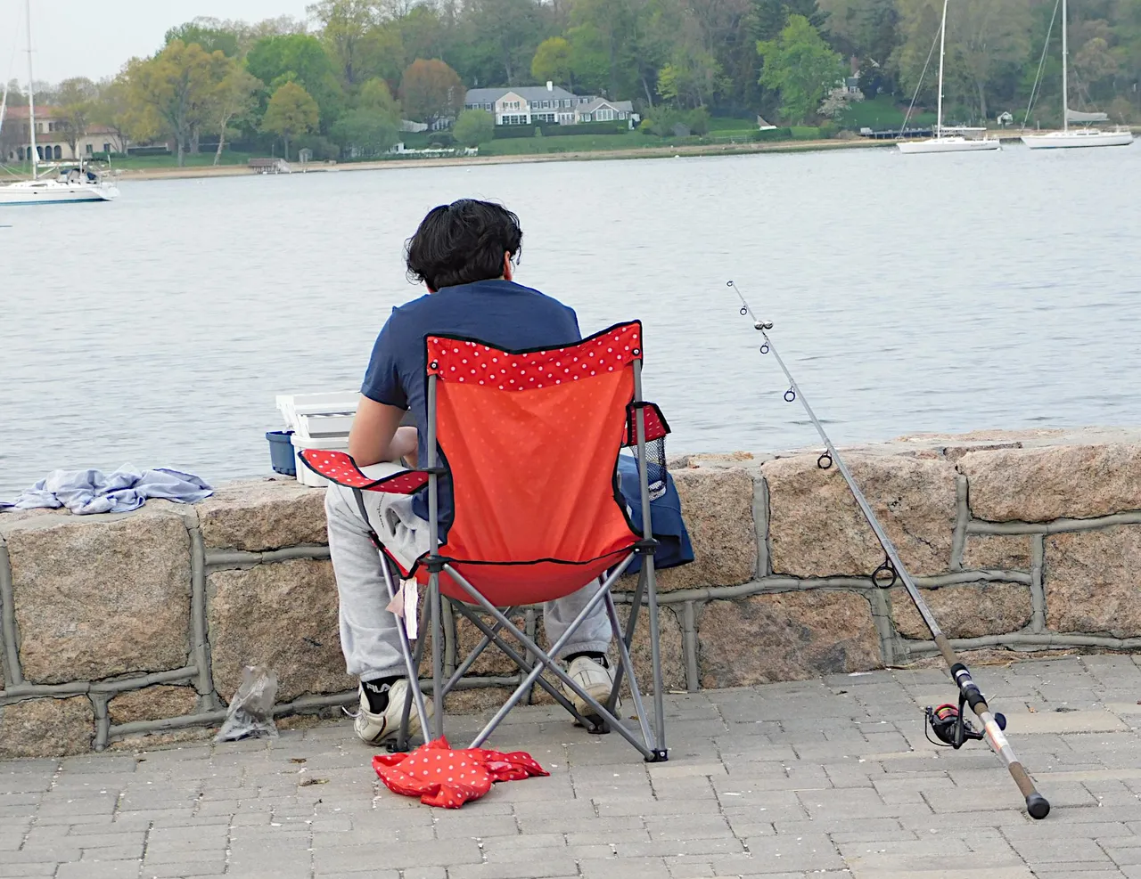 fisherman on red chair amazing nature.png