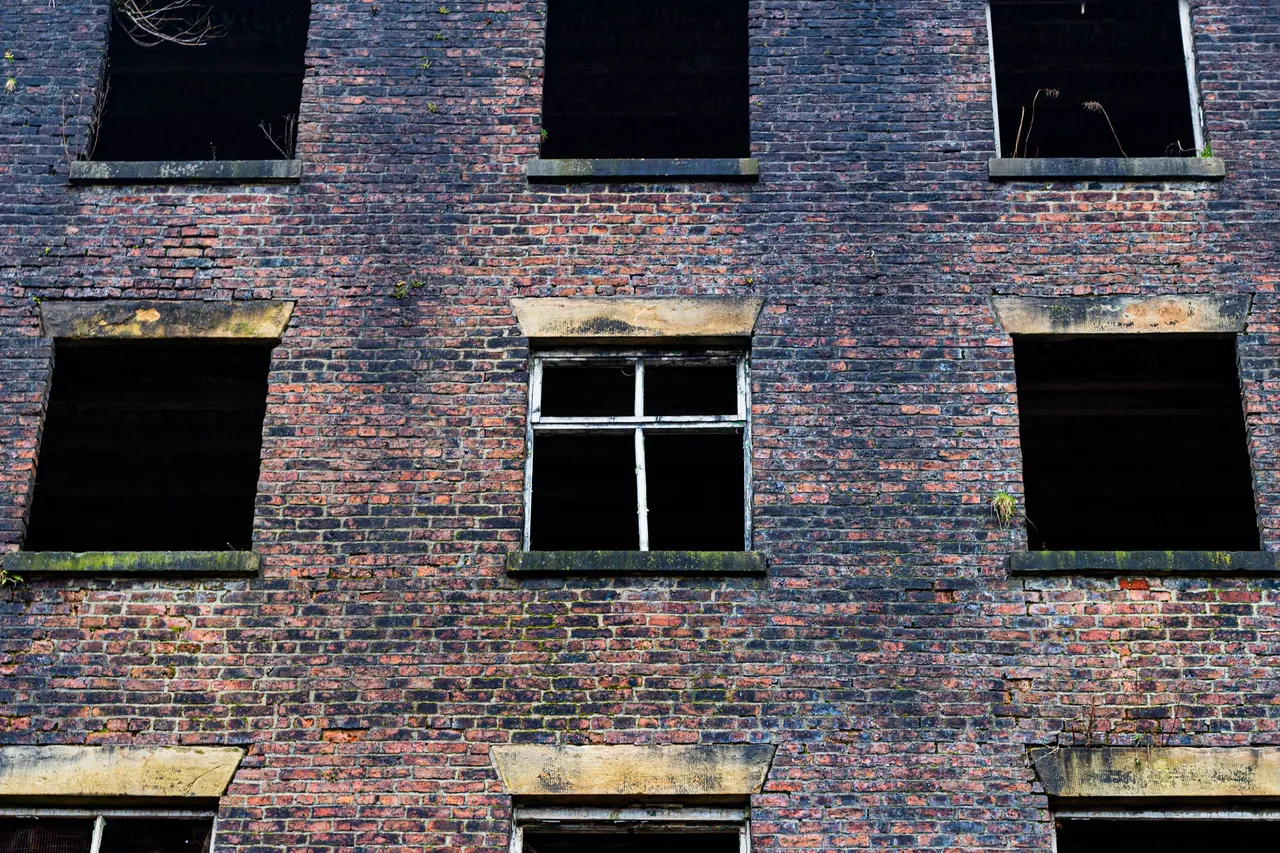 Windows of the Old Crimble Mill factory outside the town of Heywood, Greater manchester, England.jpg