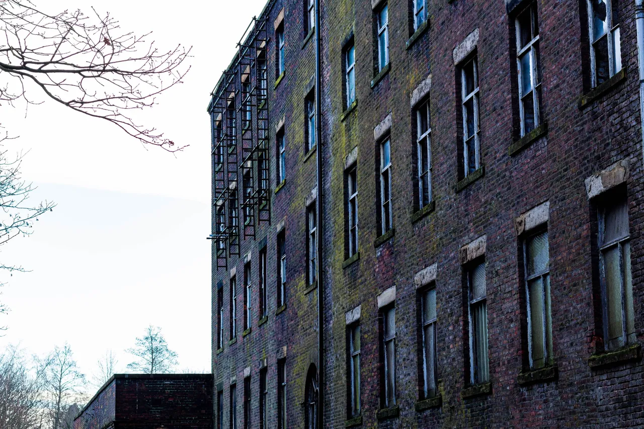 Side wall of an old abandoned factory in Heywood, England.jpg