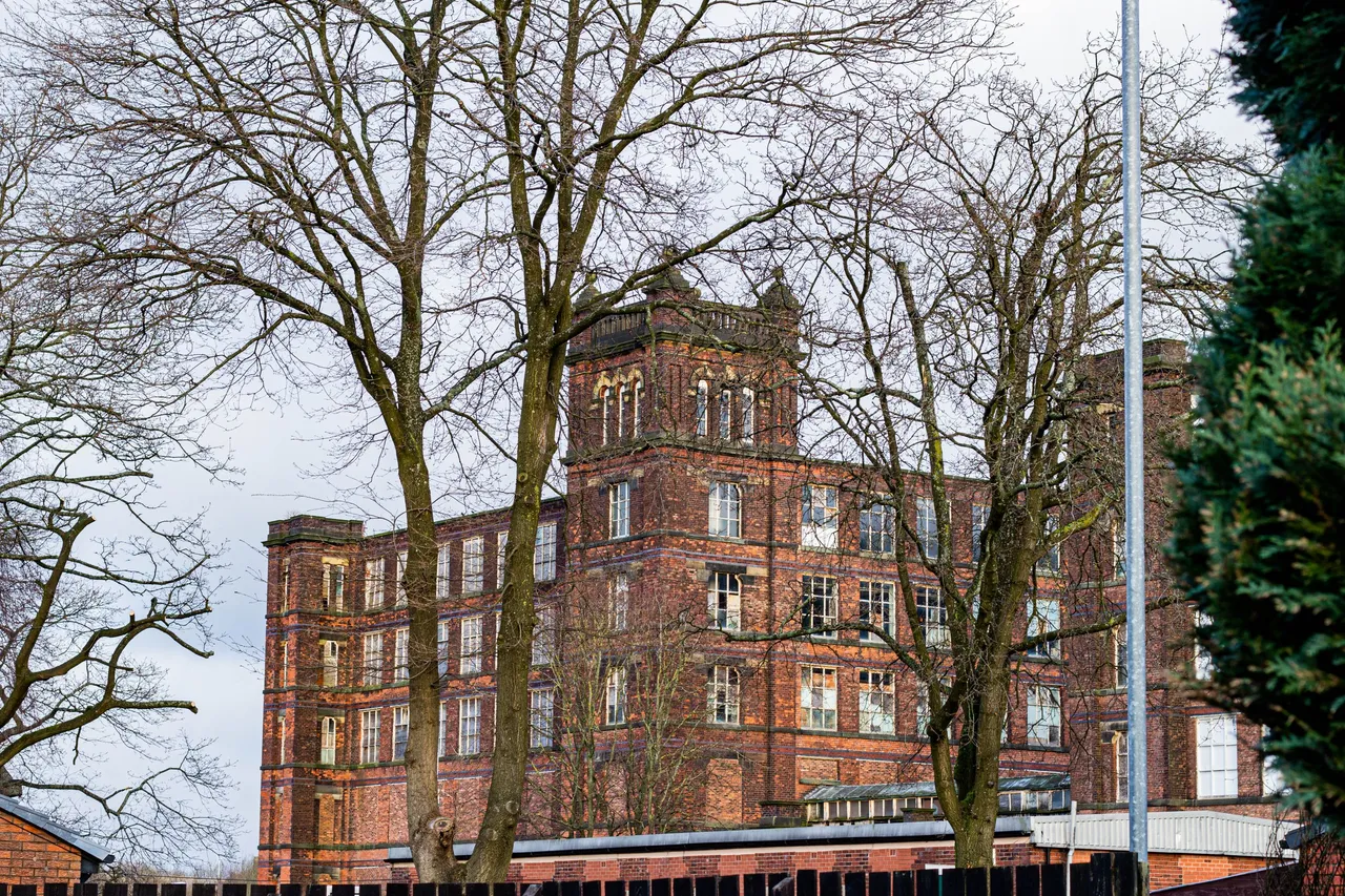 Old Factory and trees Heywood Greater Manchester UK.jpg