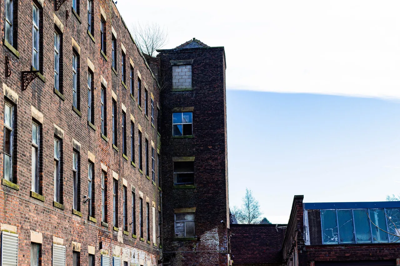 Abandoned old factory with a tower in Heywood Greater Manchester.jpg