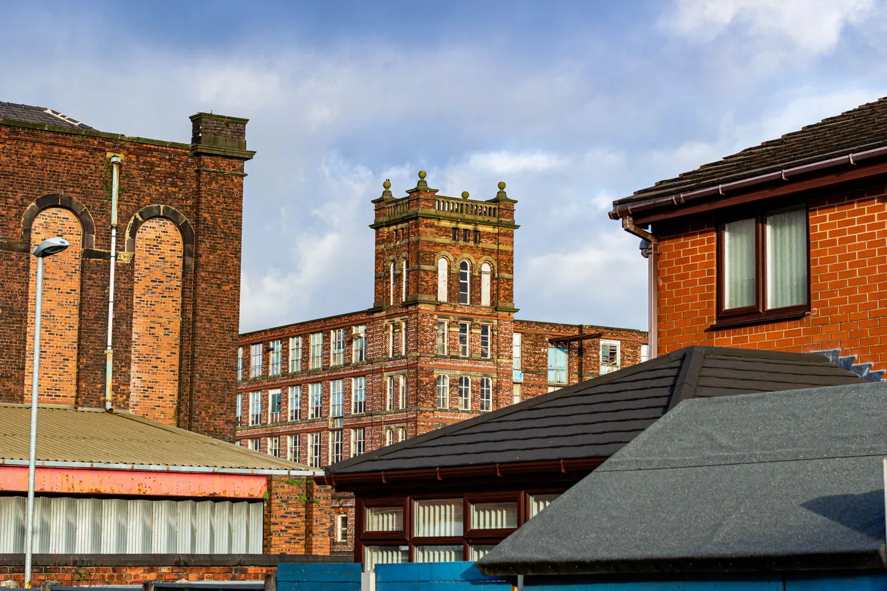 Old Factory and part of New Homes In Heywood Greater Manchester UK.jpg