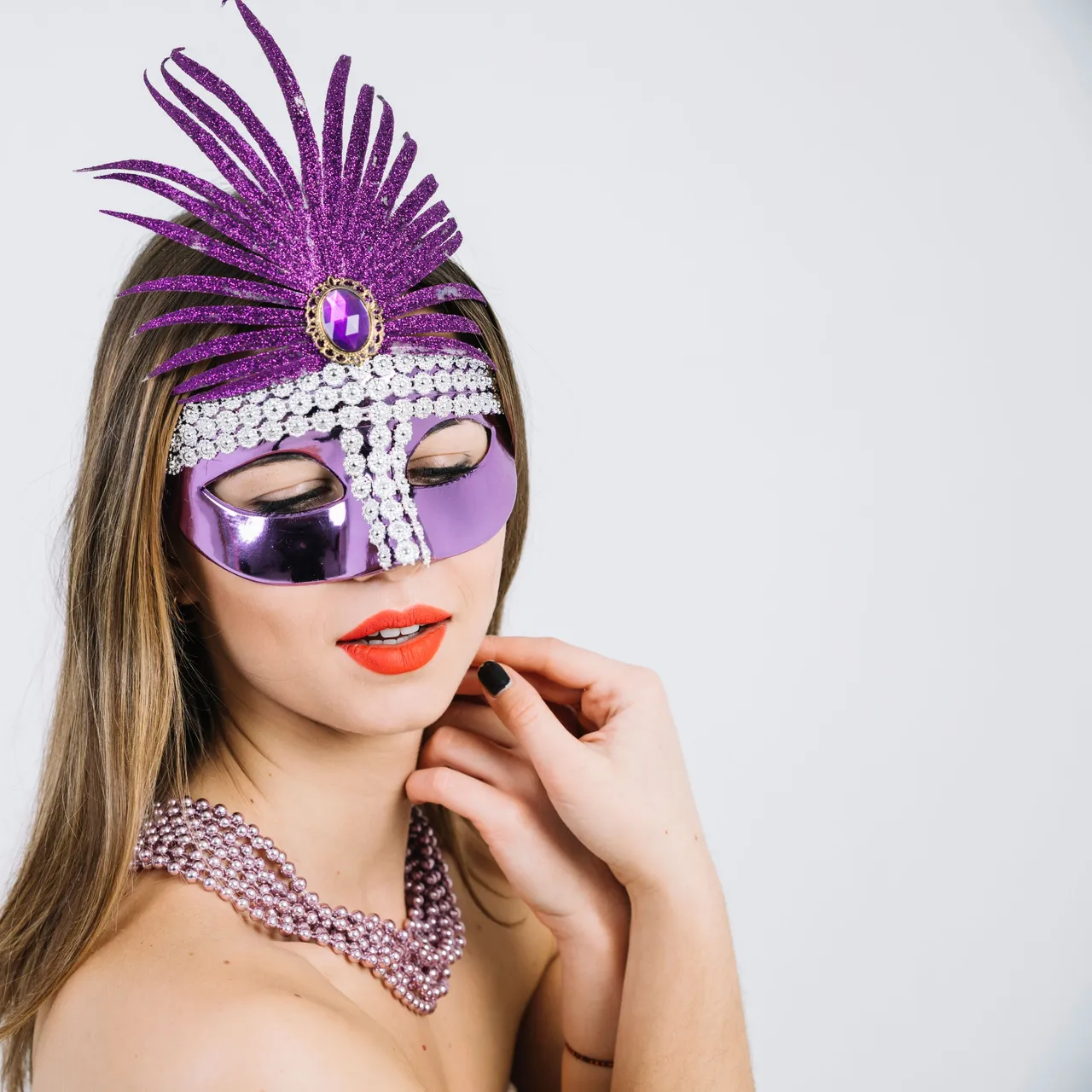 beautiful-young-woman-carnival-mask-posing-white-backdrop.jpg