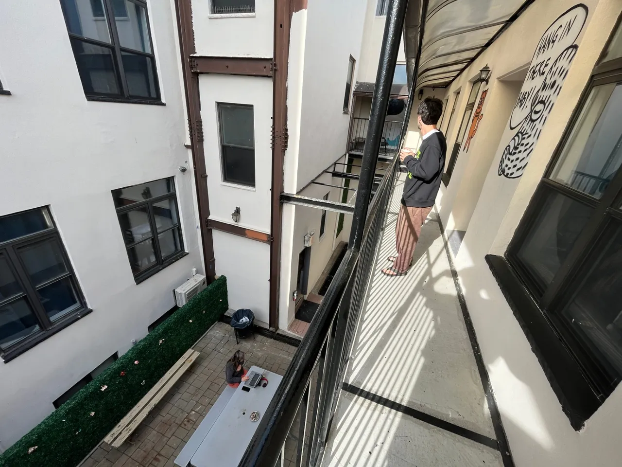 vlad enjoys our little outdoor balcony at the hostel