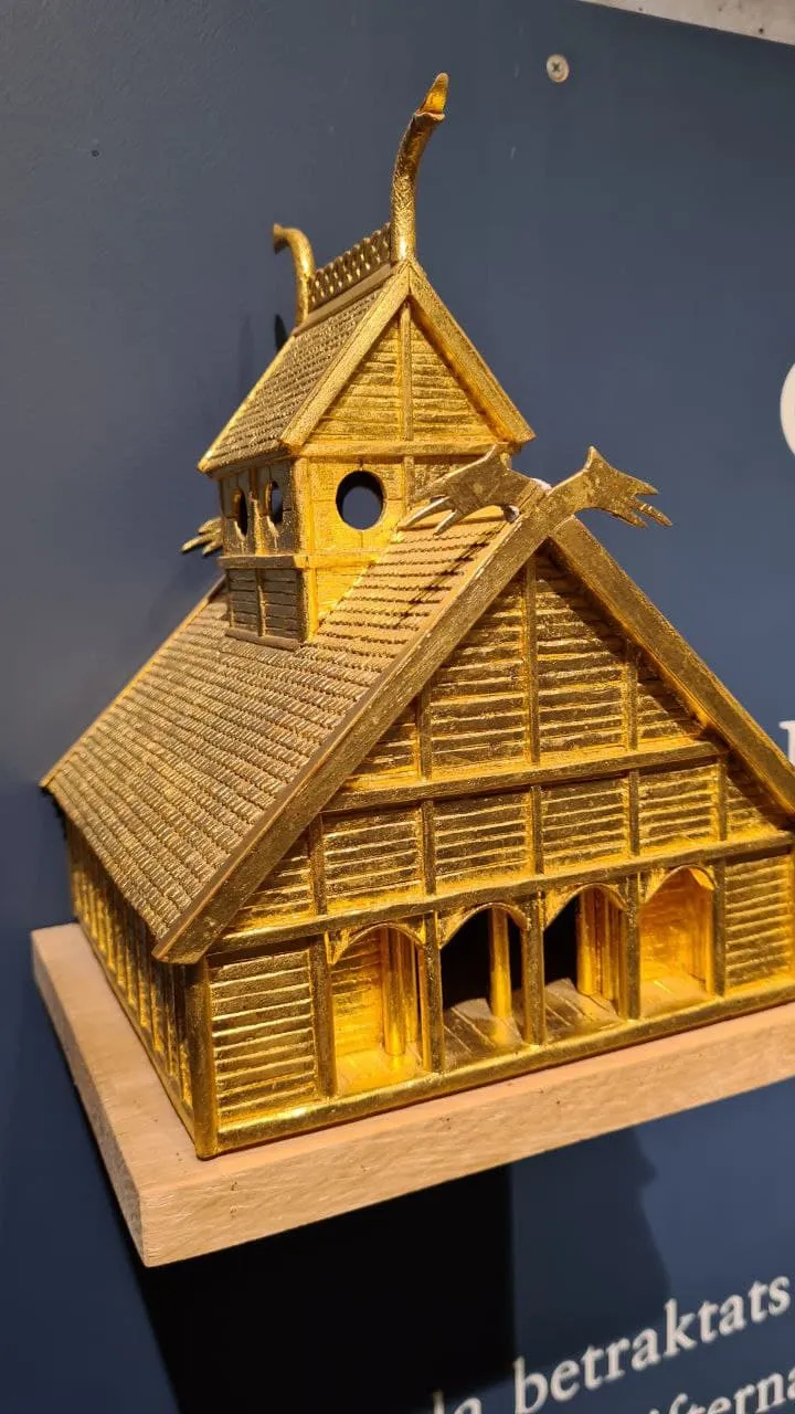 It is a model of Gamla Uppsala Temple where it was here before Christianity was introduced to Sweden.