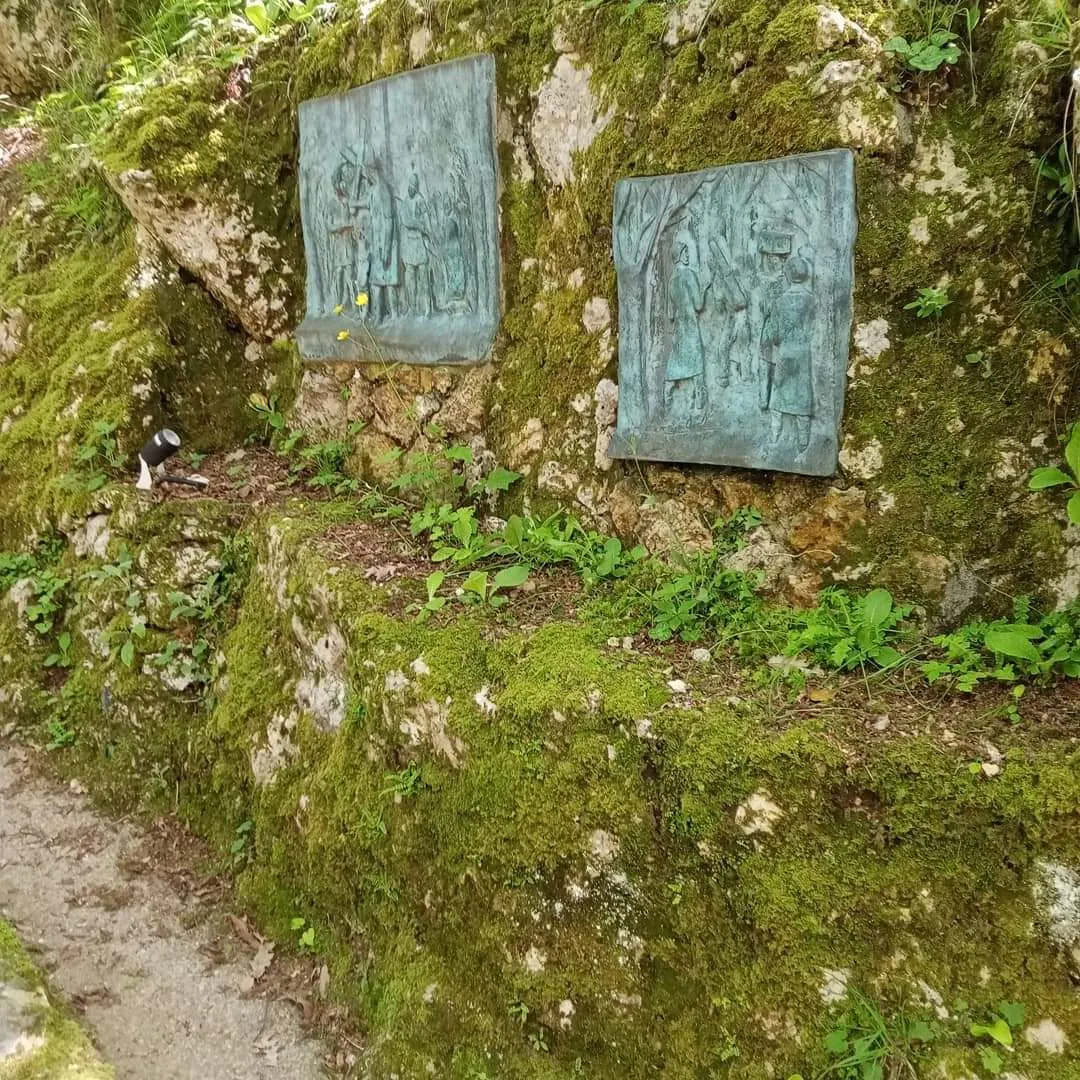 The sculptures in the wood.
