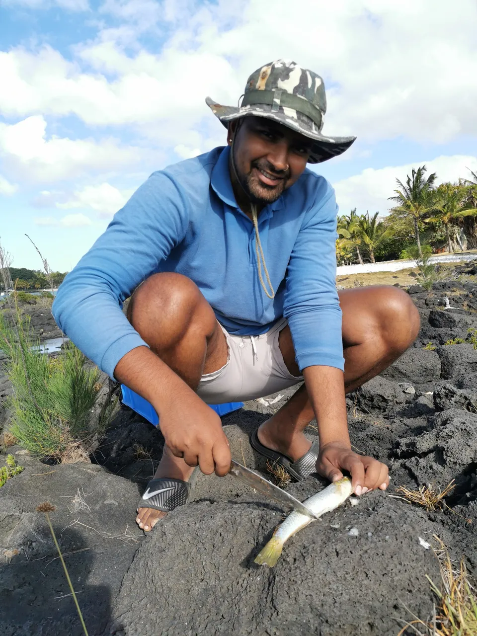Karan cleaning the first catch and cut as bait...