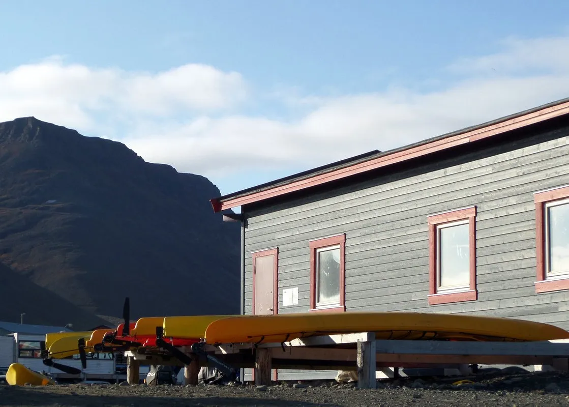 Kayaks stored in a row in Longyearbyen.