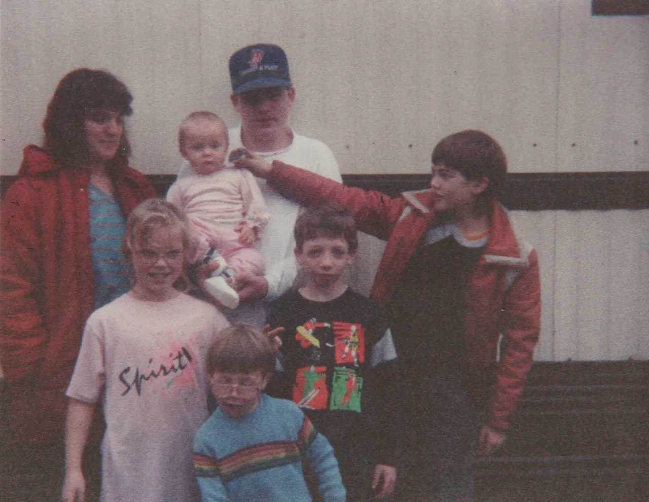 1990-12-25 - Karen, Crystal, Nathan, Alan, Katie, Rick, Joey, Crystal is around 9 months, in the winter, around Christmas.png