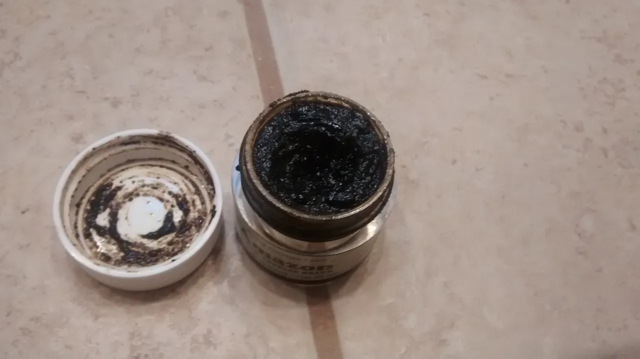 A thick, black, tar-like, sweet-smelling paste...