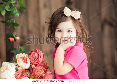 stock-photo-little-girl-fo-years-old-with-brown-wavy-hair-and-bow-sits-on-a-wooden-ladder-with-becket-398036869.jpg