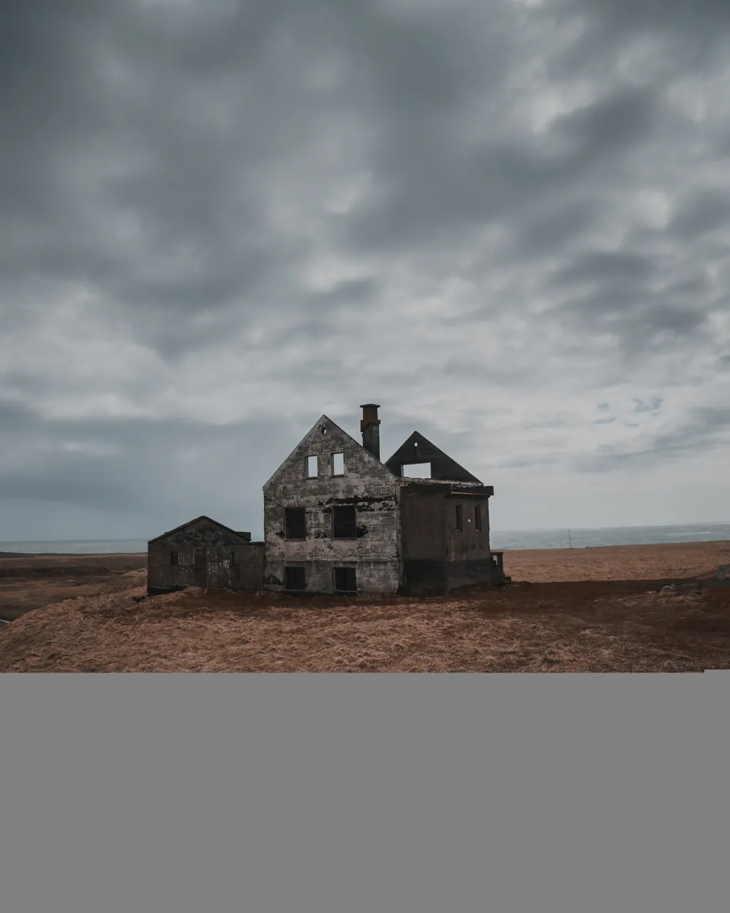 beautiful-shot-old-abandoned-half-destroyed-house-large-brownfield-gray-sky.jpg