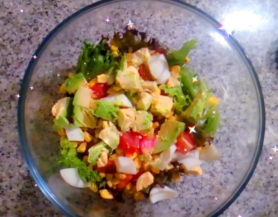 Mixed salad with eggs, avocado, corns and tomato
