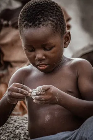 free-photo-of-cute-little-boy-playing-with-sand.jpeg