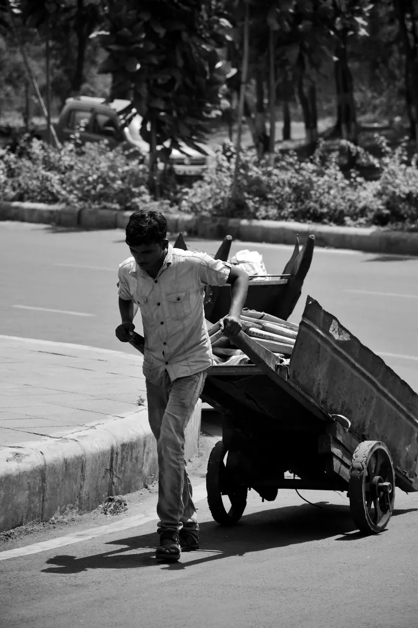 free-photo-of-a-man-pushing-a-cart-with-a-man-on-it.jpeg
