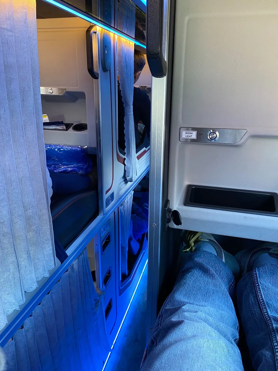 Definitely gives you capsule hotel feels.  With 3 columns of seats within the bus, I think it's a bit cramp for passing by.
