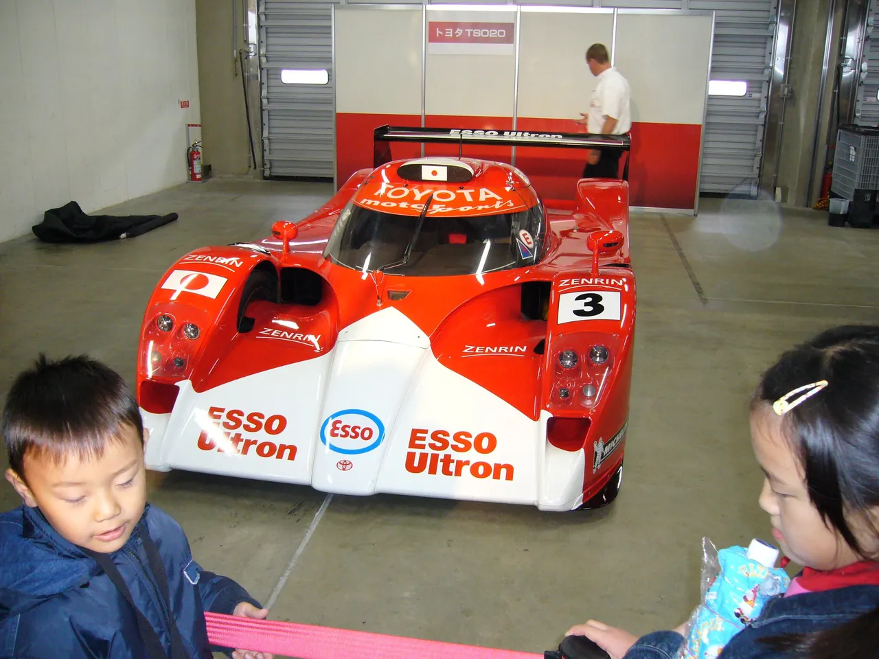 248 - Some children enjoying (in my opinion) the coolest car here.