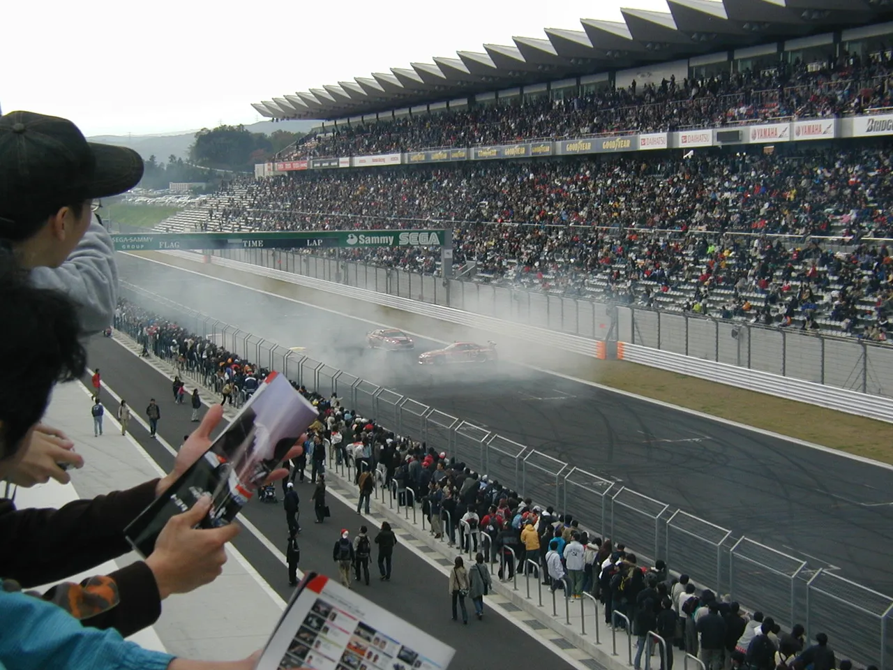 264 - Drift cars doing a quadruple donut. That's right, FOUR cars simultaneously doing the same donut. This takes skill to stay that close to 3 other cars, all while you can't see anything due to tire smoke.