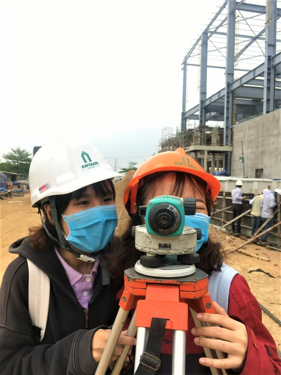 The beautiful girls practicing adjusting the aperture meter