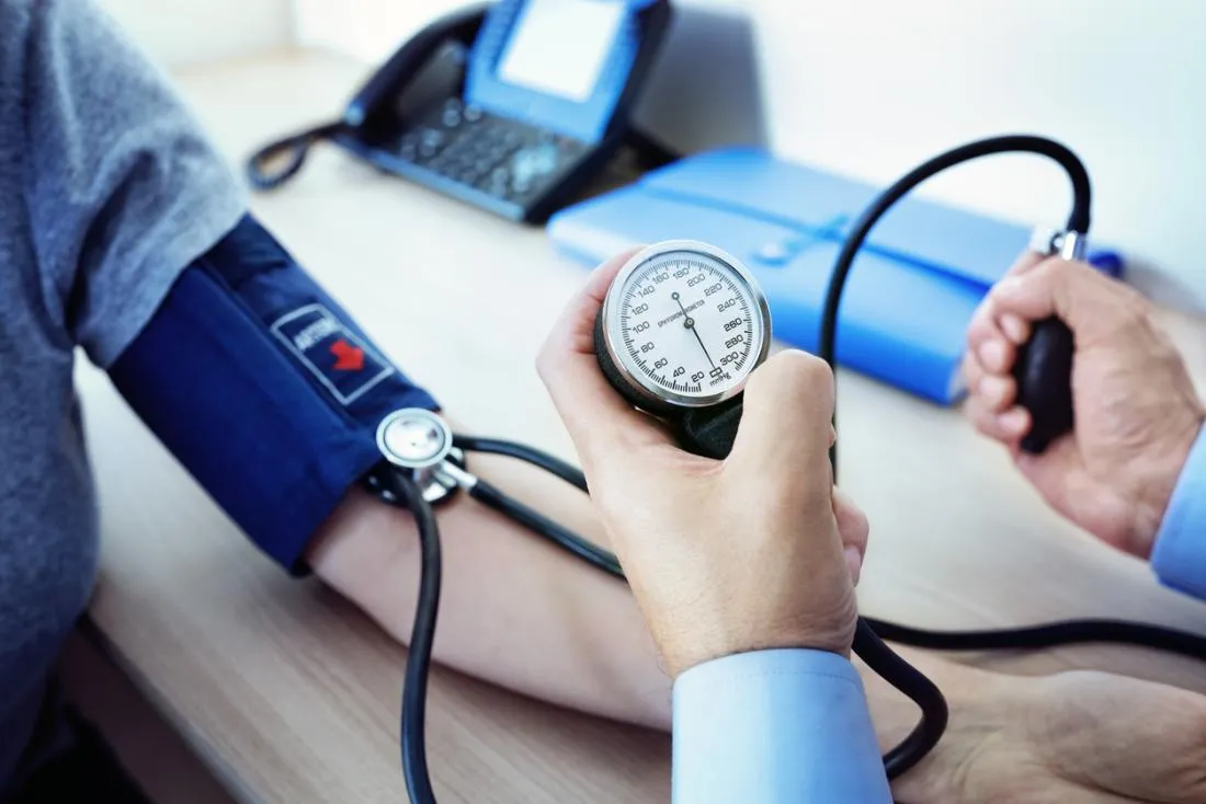 a-doctor-measuring-a-patients-blood-pressure.jpg