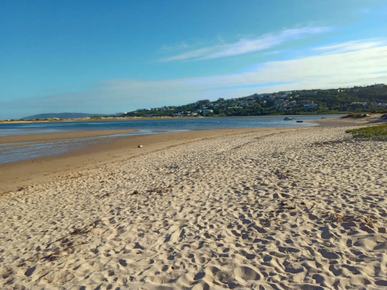 Low tide at the lagoon with the town of Plettenberg Bay in the background