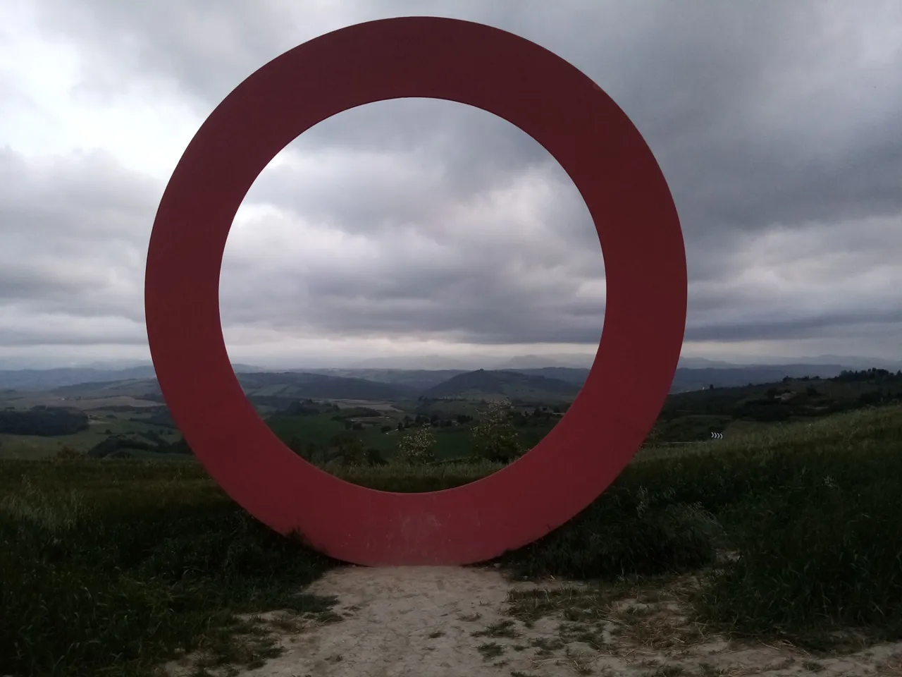 There are three of this circles. They are sculptures made by Mario Staccioli. I don’t know what to make of them but taking photo with them is fun!