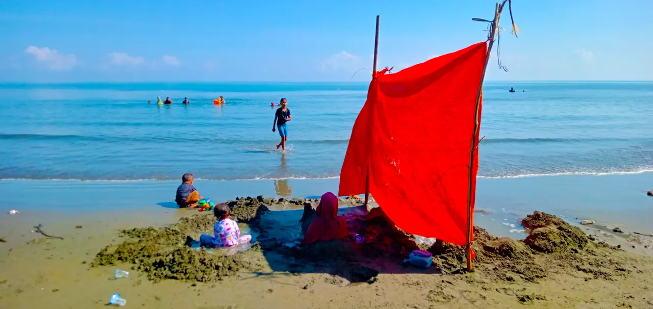 seen small children and mothers who were burying themselves in the sand.