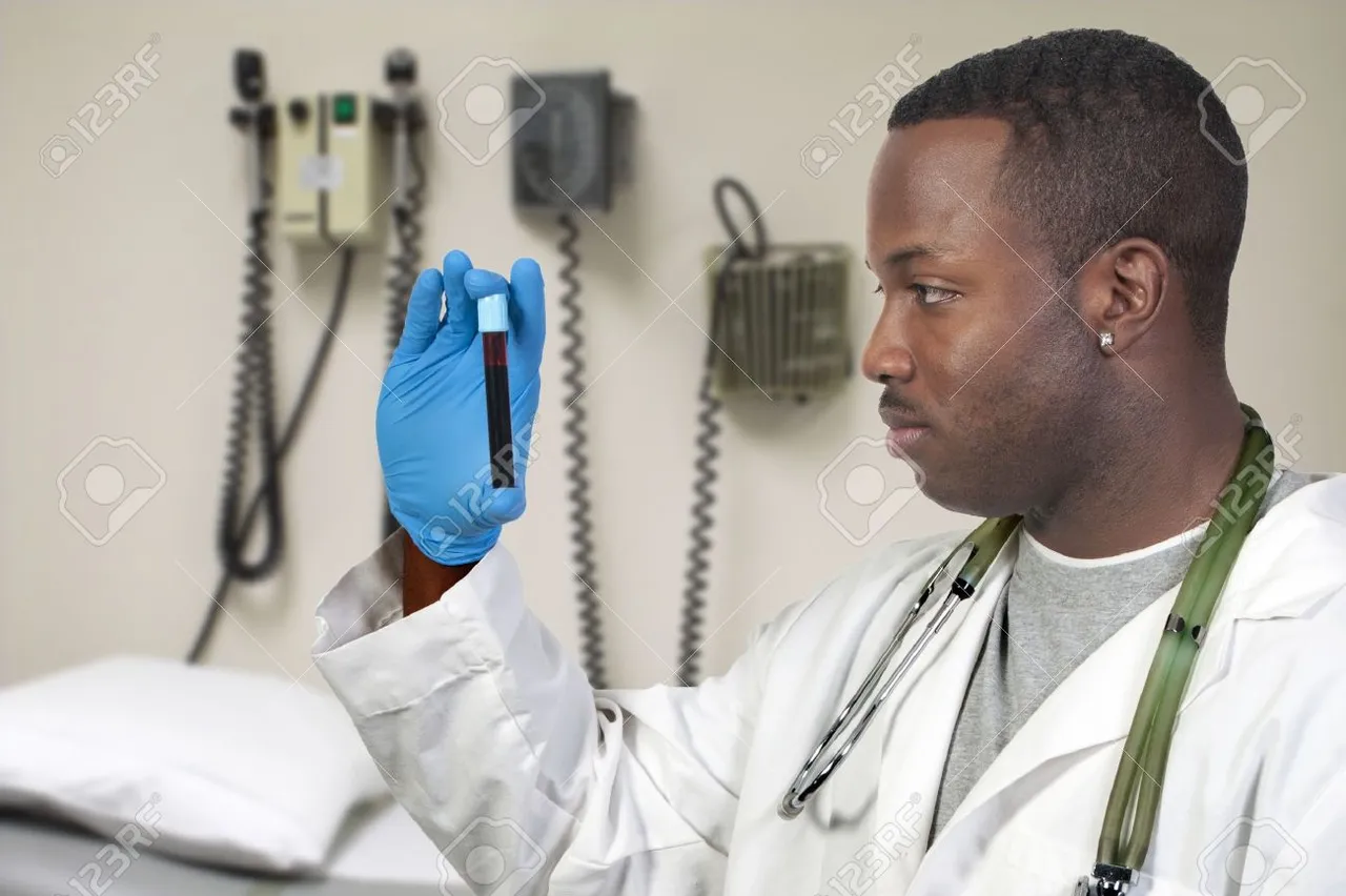 8672839-A-black-man-African-American-doctor-holding-a-test-tube-vial-sample-of-blood-Stock-Photo.jpg