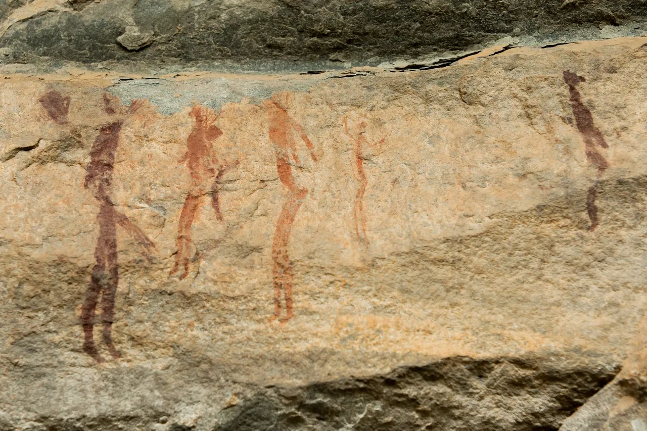 San people possibly preparing to go out hunting or in a tribal ritual.