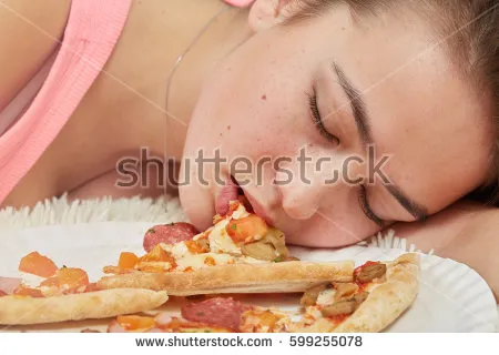 stock-photo-fun-sad-overeat-girl-lying-with-pizza-pieces-599255078.jpg