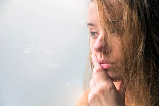 lonely-girl-near-window-thinking-about-something-beautiful-sad-lonely-girl-sitting-near-the-window-is-missing_1391-433.jpg