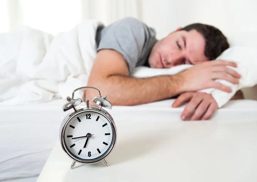 Young-attractive-man-sleeping-on-bed.jpg