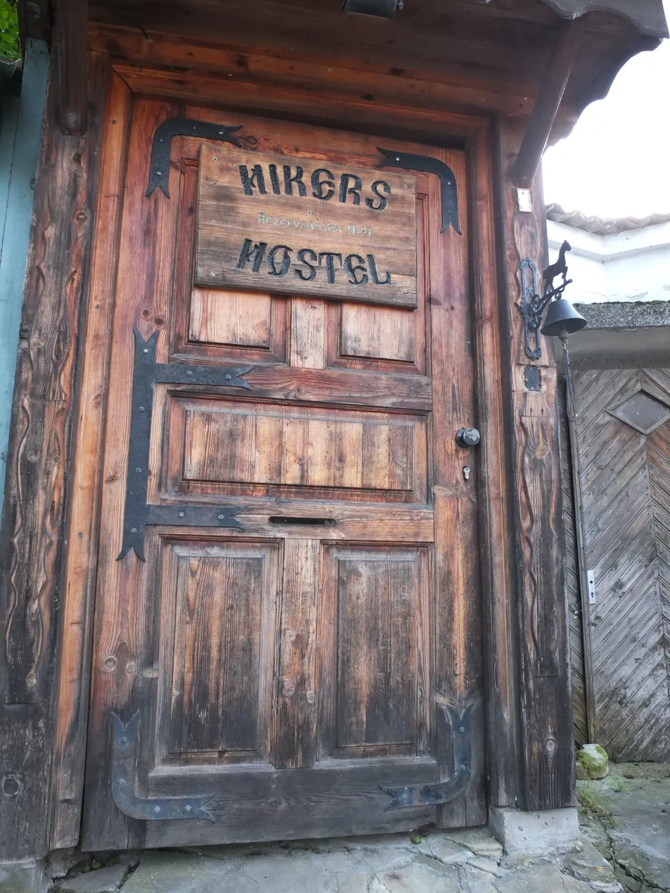 The gate of Hiker’s Hostel resembles an old tavern.