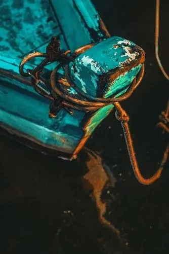 Boat tethered by rope unsplash.jpg