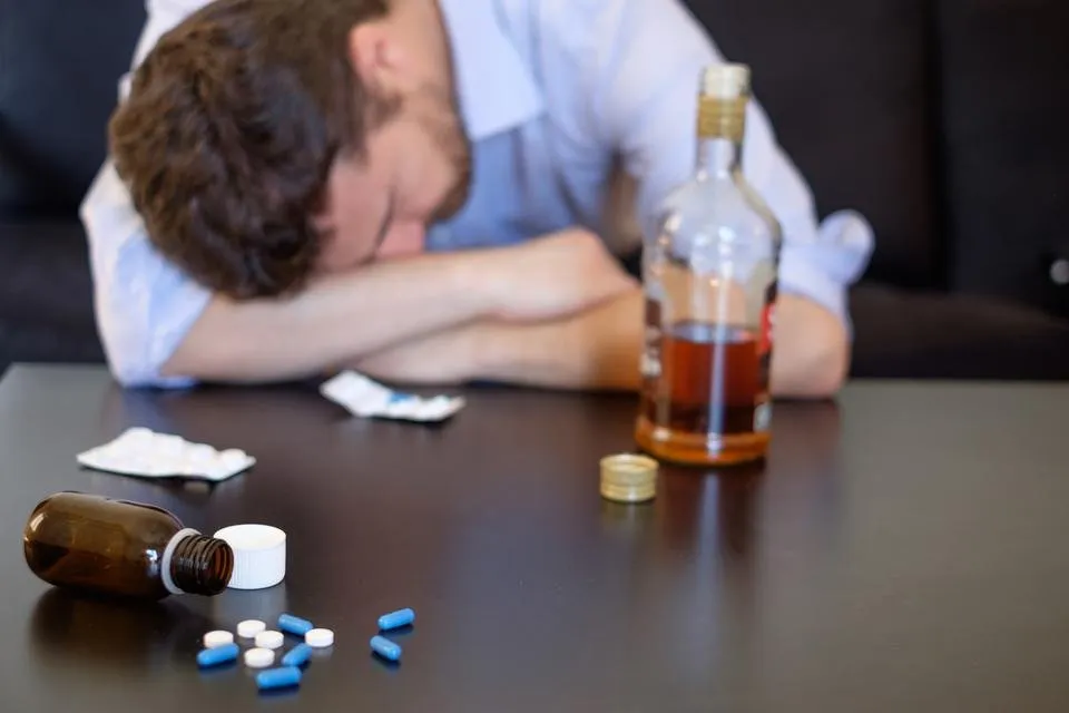 man-addicted-to-pills-and-alcohol.jpg