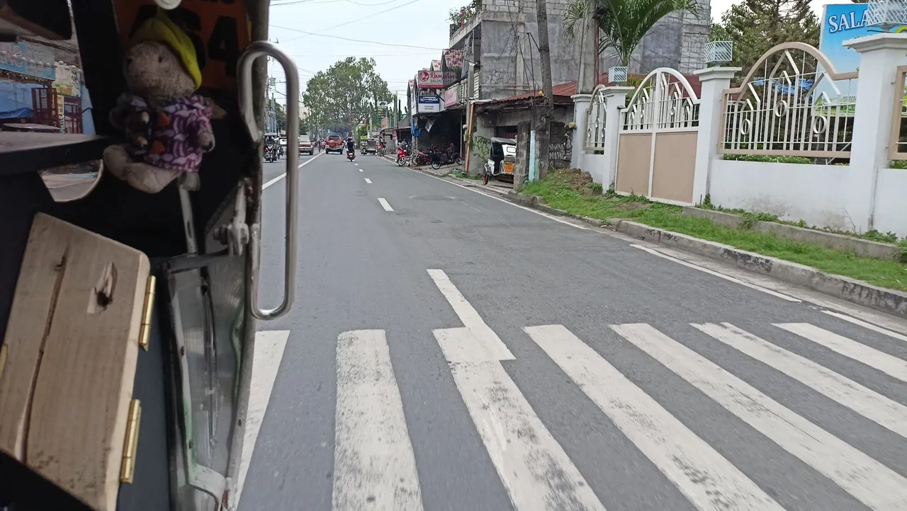 Guy riding in a tricycle.jpg