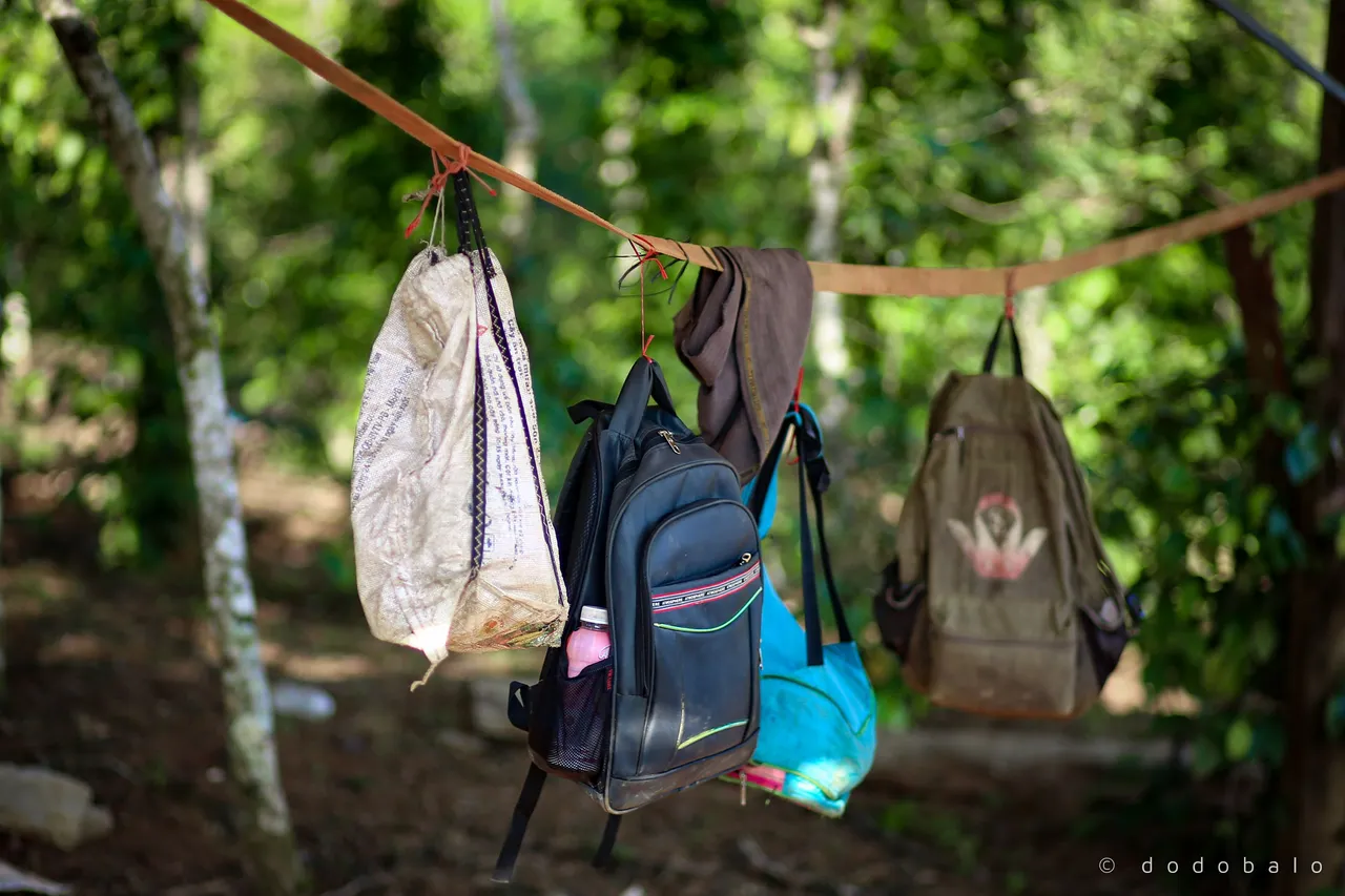 The farmers carry their clothes, food and drinks to be able work on the farm one day.