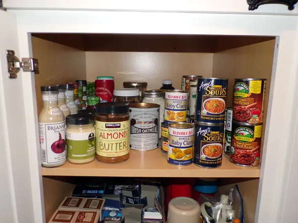 White cabinet - canned goods crop Sept. 2023.jpg