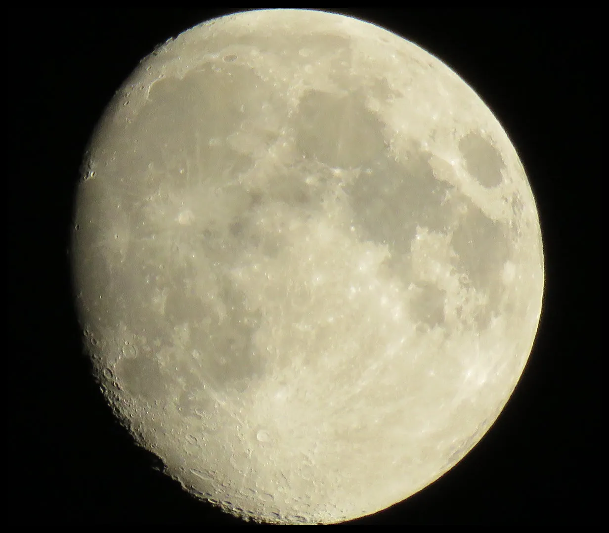 close up showing details on surface of almost full moon.JPG