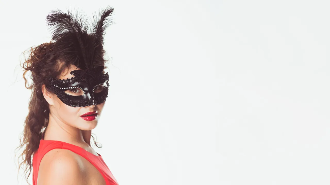 woman-wearing-black-mask-with-feathers.jpg