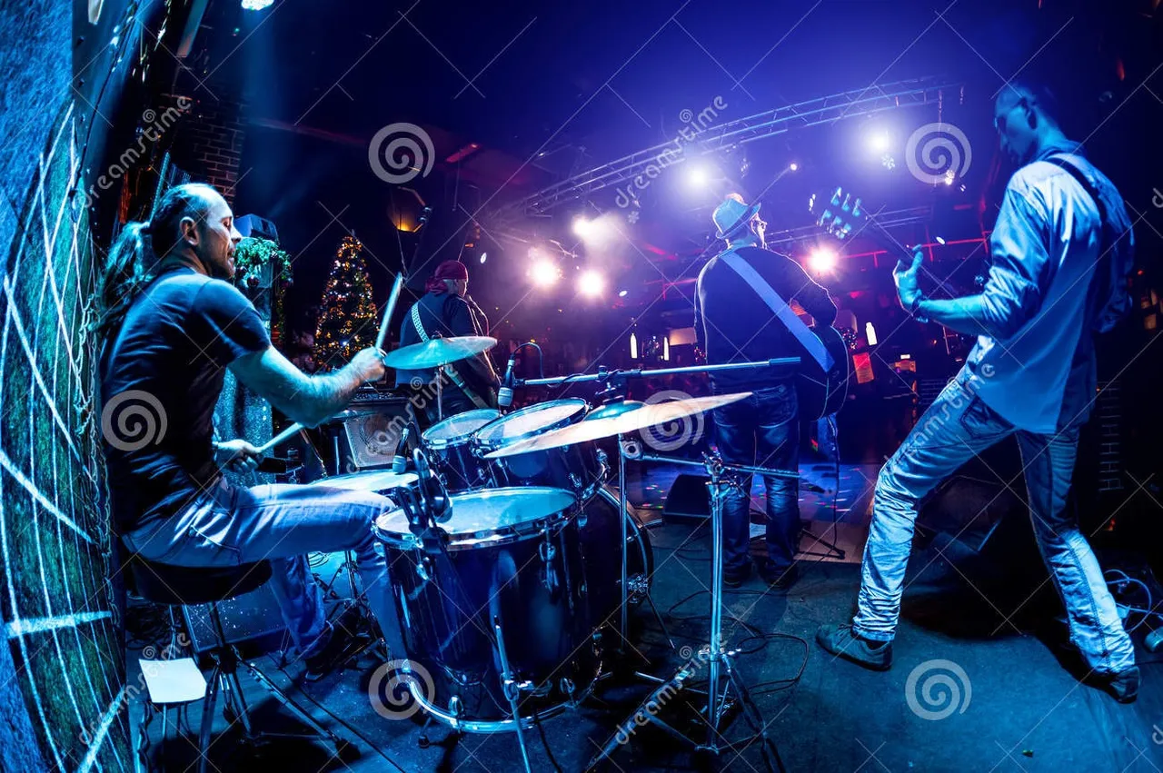 band_performs_stage_rock_music_concert_36883828.jpg