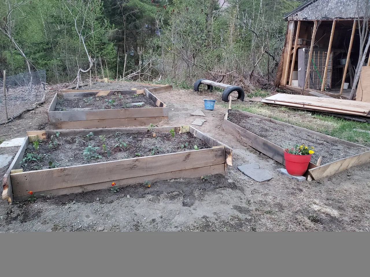 part disassembled barn and garden beds.jpg